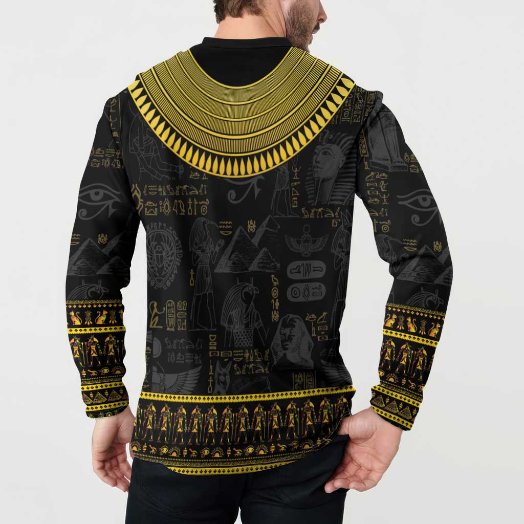 Black sweatshirt with gold Egyptian icon print and striped border, long sleeves