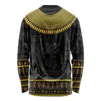 Unisex black long-sleeve shirt with gold Egyptian hieroglyphs and figure motifs across back