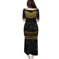Black long dress back view with gold Egyptian ankh-hieroglyph border, short sleeves