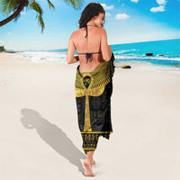 Black sarong with gold ankh motif and border print, tied at waist