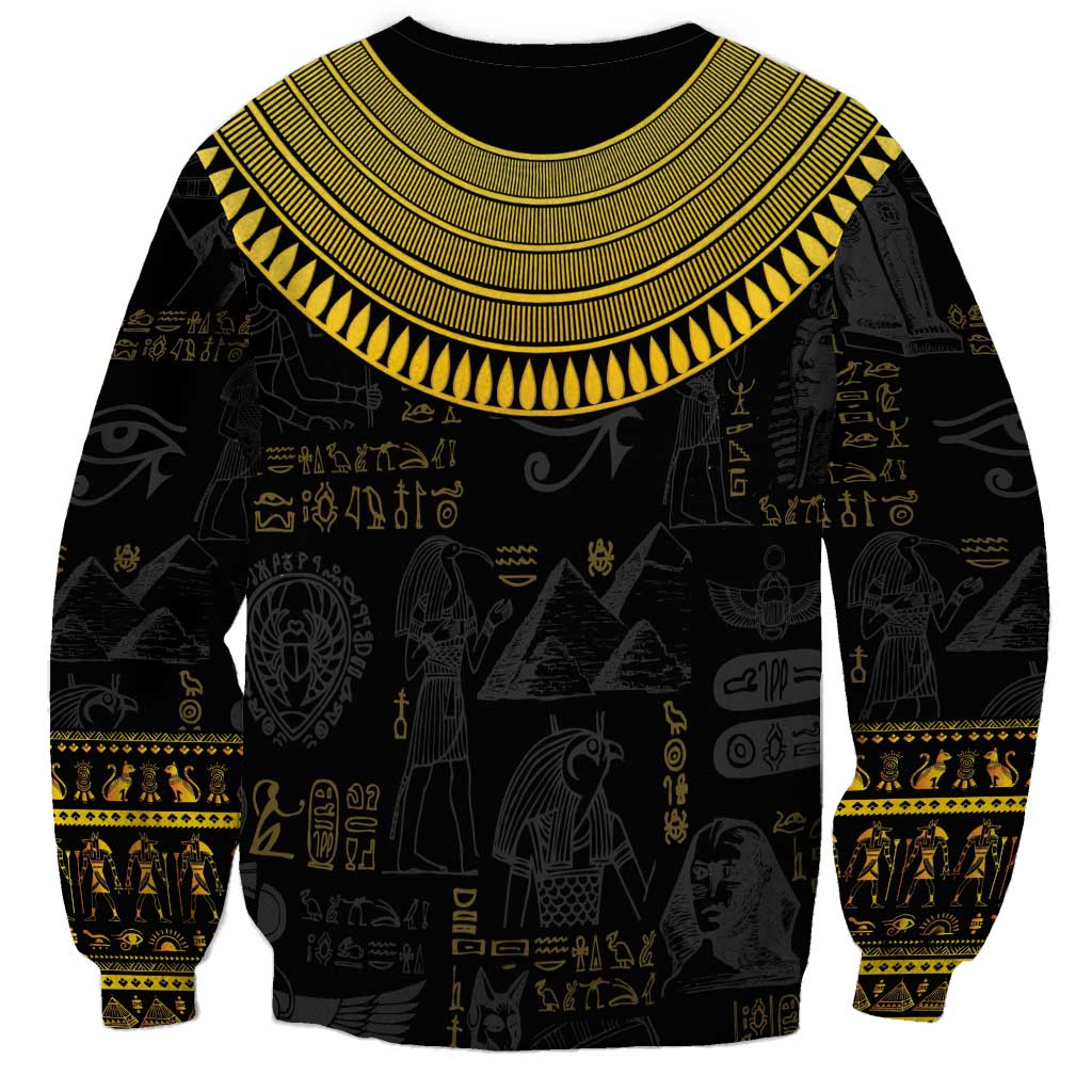 Black unisex sweatshirt with gold Egyptian hieroglyph pattern and wide winged collar