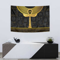 Gold ankh symbol in center of black Egyptian tapestry, with winged arch and border