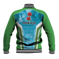 Green-and-blue baseball jacket with striped rib collar, back graphic reading YOUR TEXT.