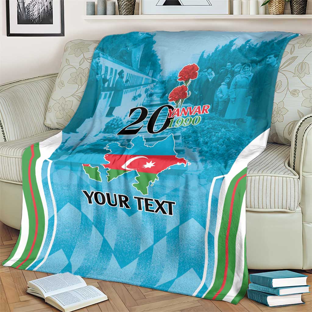 Personalized blue blanket on cream armchair with map and 20 Yanvar 1990 design, striped border
