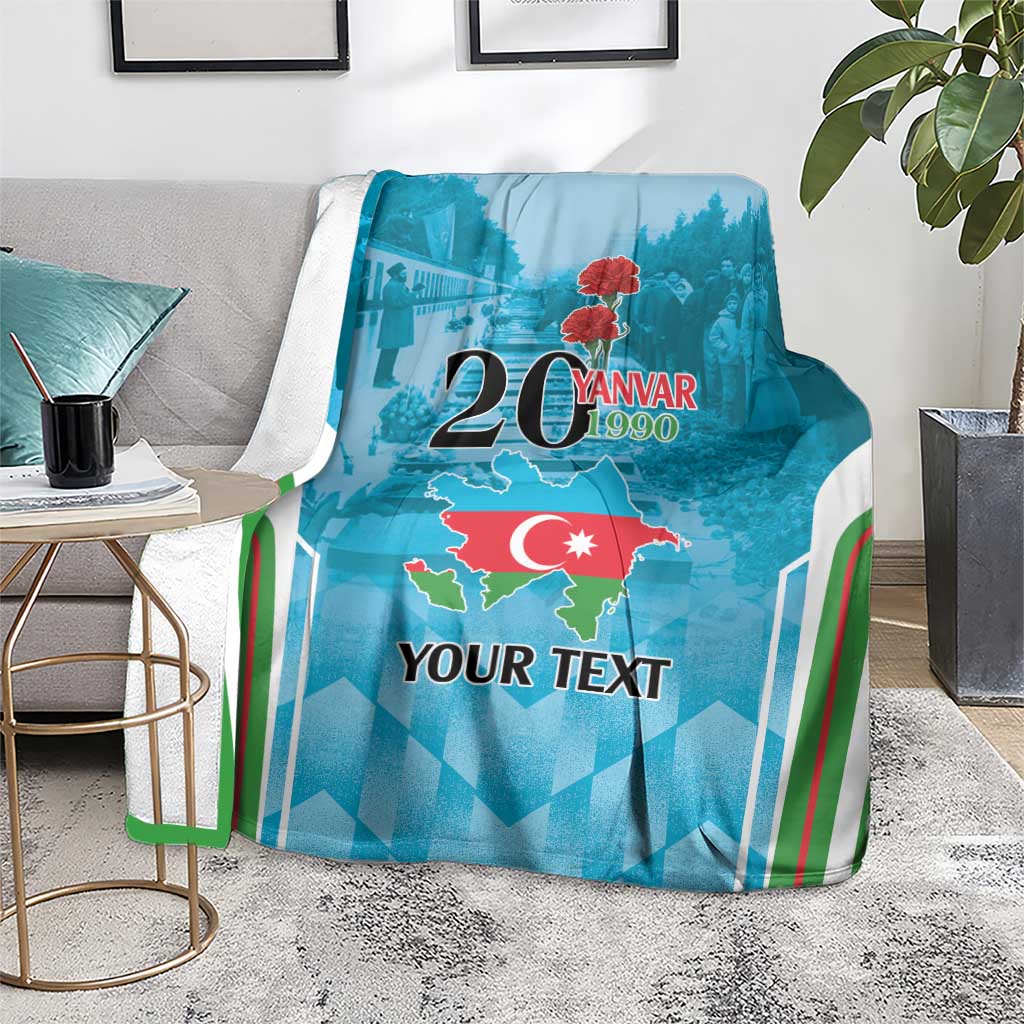 Personalized blue throw blanket on gray floor with map graphic, 20 Yanvar 1990 and striped trim