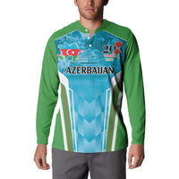 Green button-up sweatshirt on model with blue Azerbaijan graphic and long sleeves