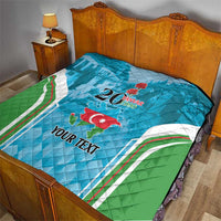Blue quilt on bed with green and white sweeping stripes, “20 Yanvar 1990”, Azerbaijan map, Your Text