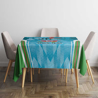 Blue tablecloth with green drape and striped pattern, printed emblem on dining table