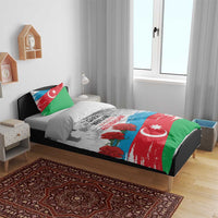 Flag-style bedding set on bed with duvet and two pillowcases featuring crescent star