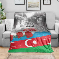 Azerbaijan flag style blanket on couch, red green blue with Qara Yanar Azerbaijan lettering