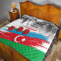 Flag-style quilt on bed with gray photo art, red flowers, crescent and star, diamond stitched