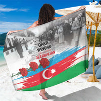 Flag-style sarong with gray crowd imagery, Qara Yanvar text, red and green stripe bands