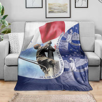 Panama-themed throw blanket on gray sofa, red-white-blue flag and statue print
