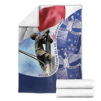Panama flag blanket with folded stacks; red, white, blue statue and circular emblem