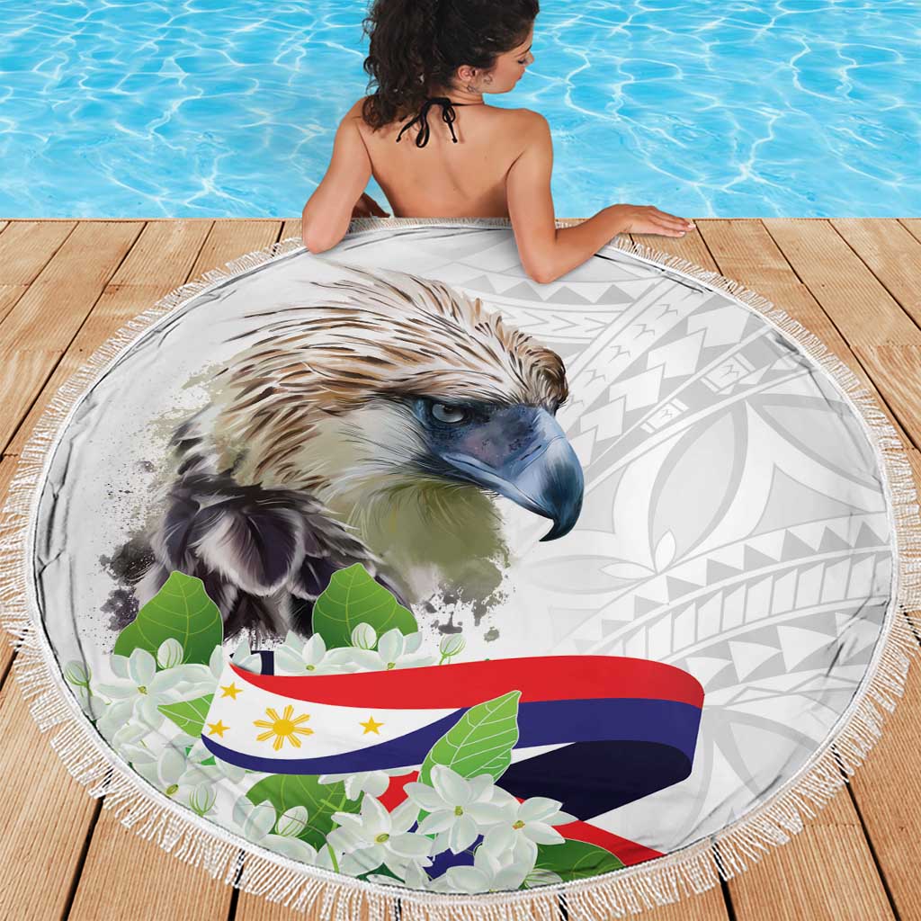 White round beach blanket with eagle face, tropical floral accents, and tassel fringe