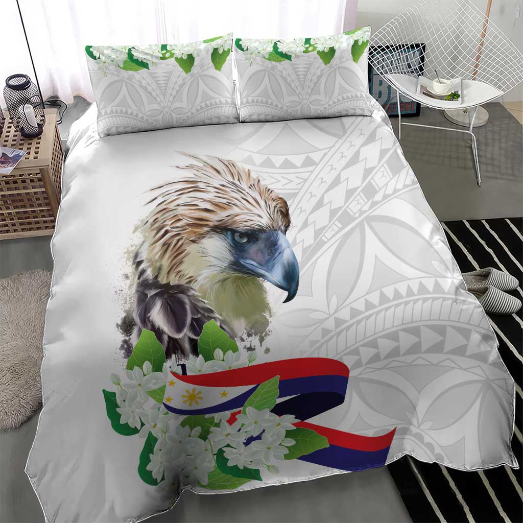 White comforter with bird portrait center, green blossoms, flag ribbon, and light gray pattern