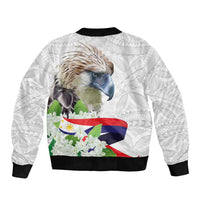 White bomber jacket back with black rib trim, eagle head, floral corner, flag print