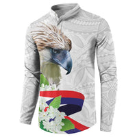 White quarter-zip sweatshirt with large eagle head, floral panel, and Polynesian sleeve patterns
