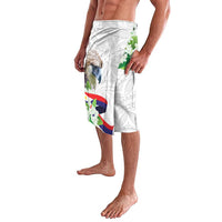 White lavalava shorts with bird, green plants, and flag graphic, side view
