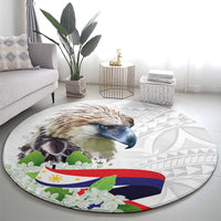 Round area rug with eagle and floral leaves on a white geometric background