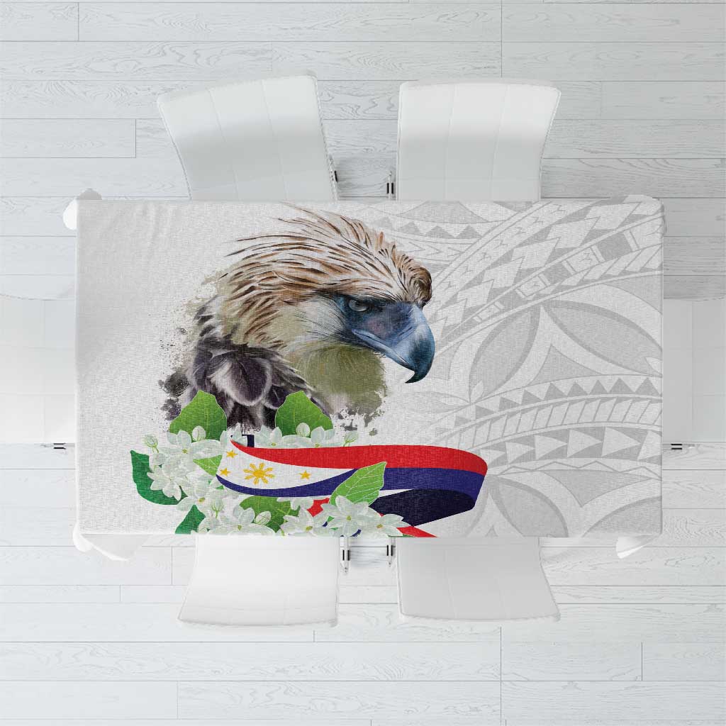 White tablecloth with polynesian eagle and sampaguita floral pattern, flat on chairs