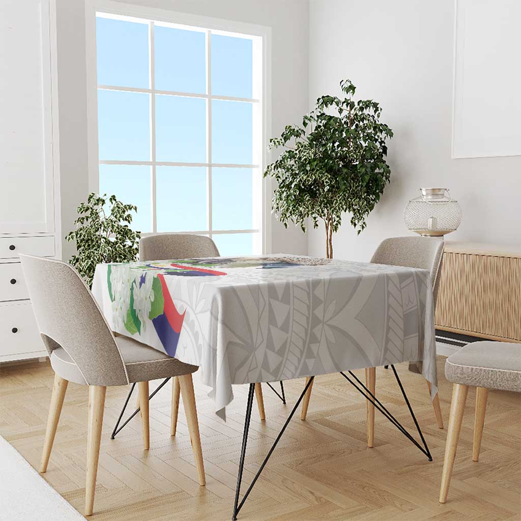 White tablecloth with polynesian eagle and sampaguita floral pattern on dining table