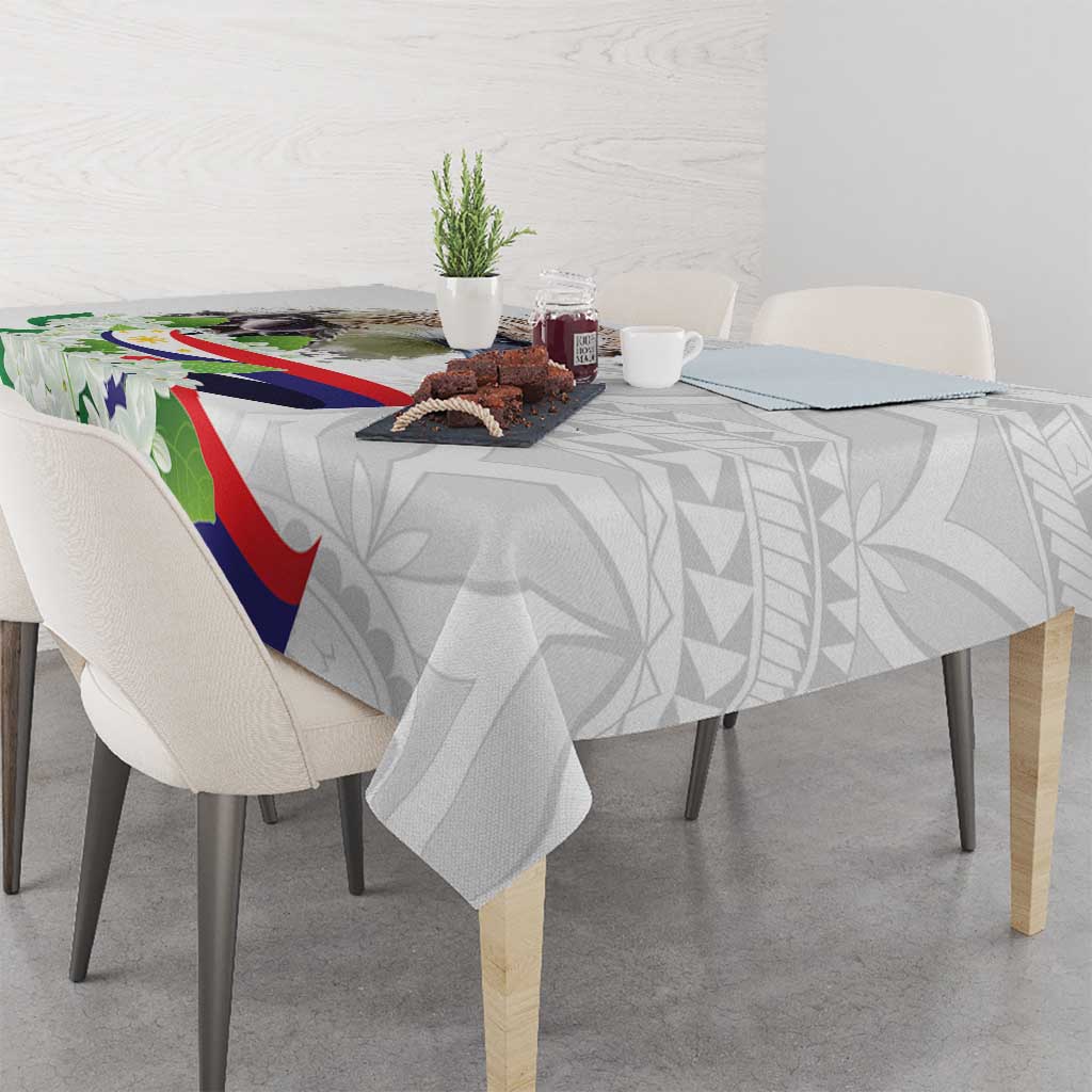 White tablecloth with polynesian eagle and sampaguita floral pattern, table corner view