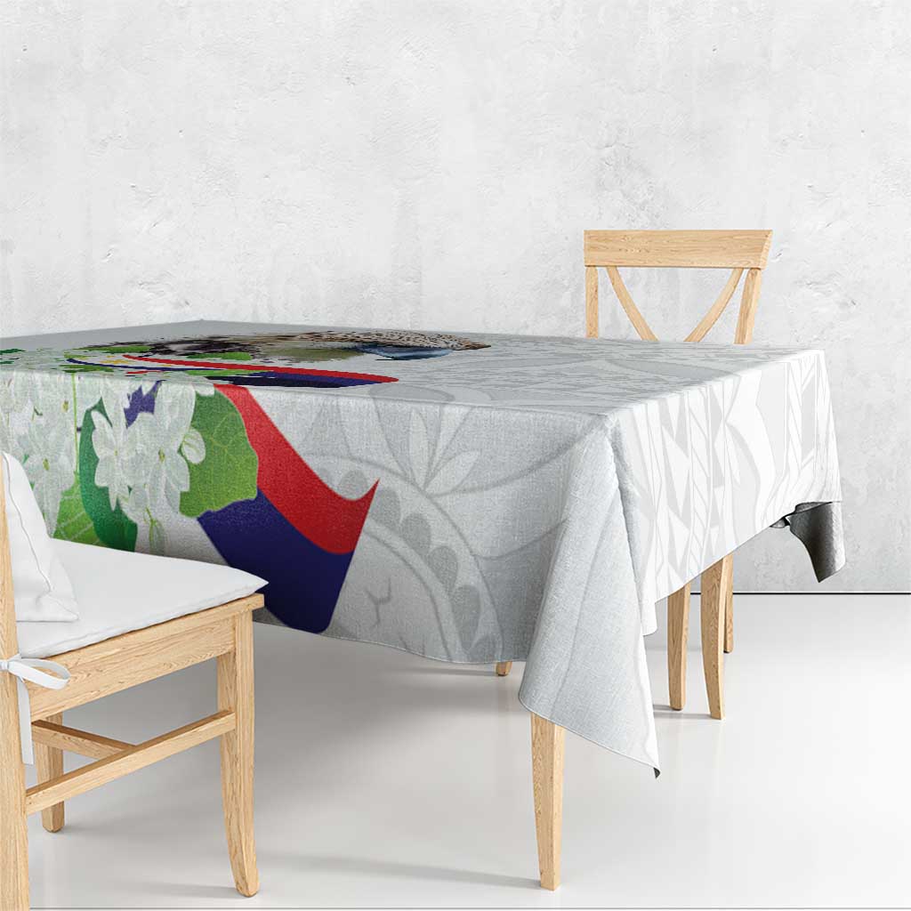 White tablecloth with polynesian eagle and sampaguita floral pattern, side draped