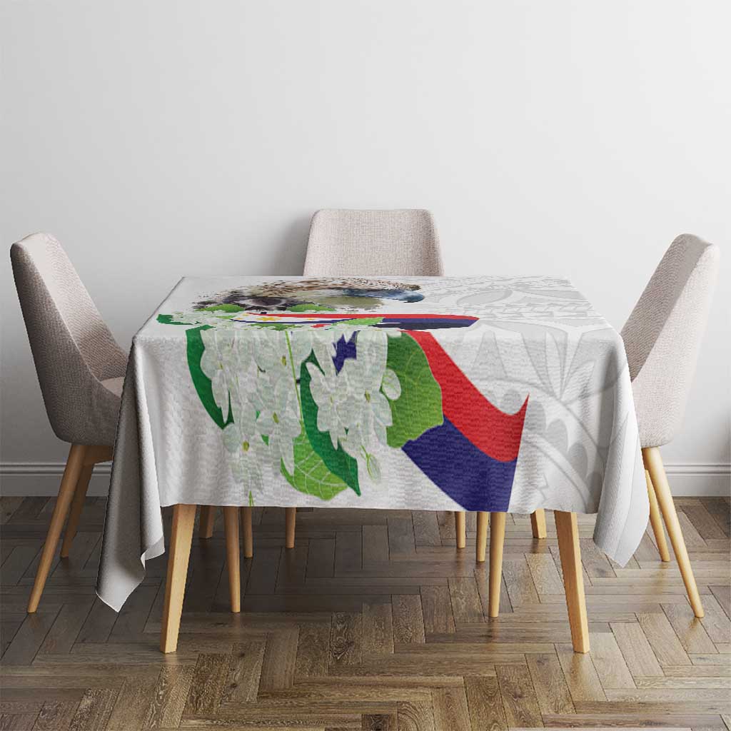 White tablecloth with polynesian eagle and sampaguita floral pattern on round table