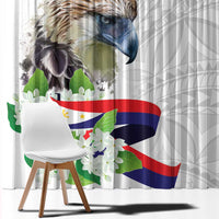 Close view of white curtain featuring eagle head and sampaguita flower and flag print