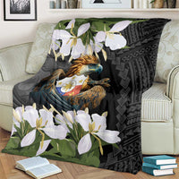 Black blanket with detailed eagle emblem, white jasmine-like flowers, and green leaves