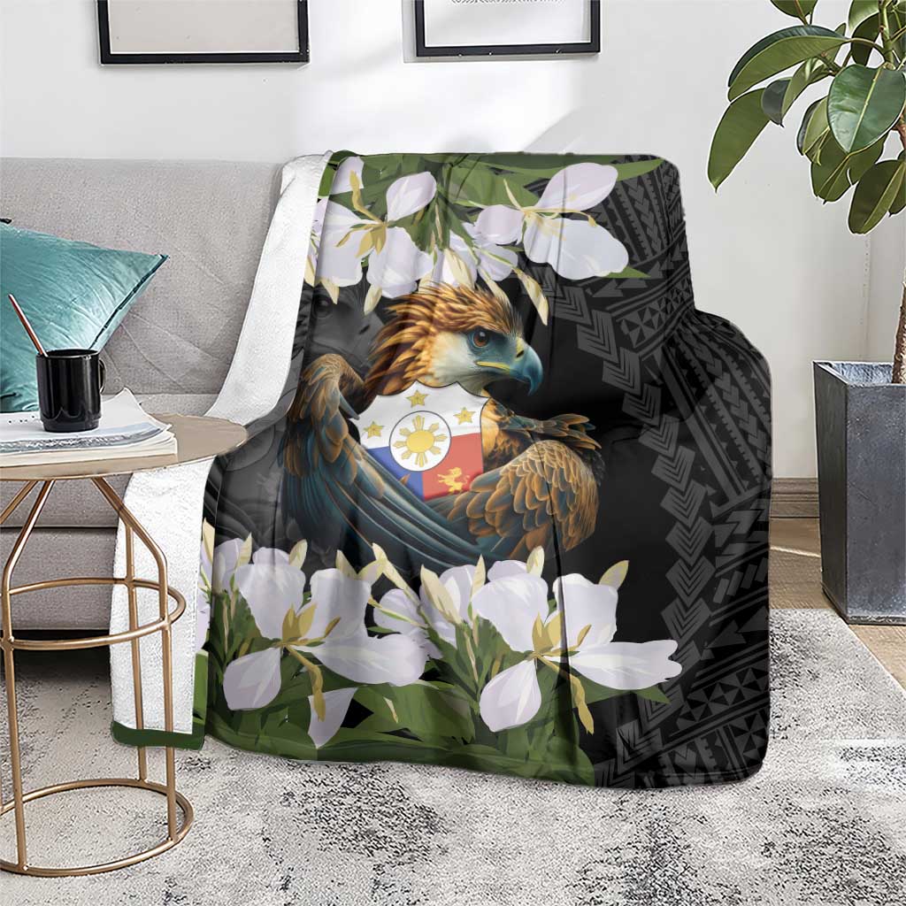 Black eagle blanket with white flowers and green foliage, geometric pattern on one side