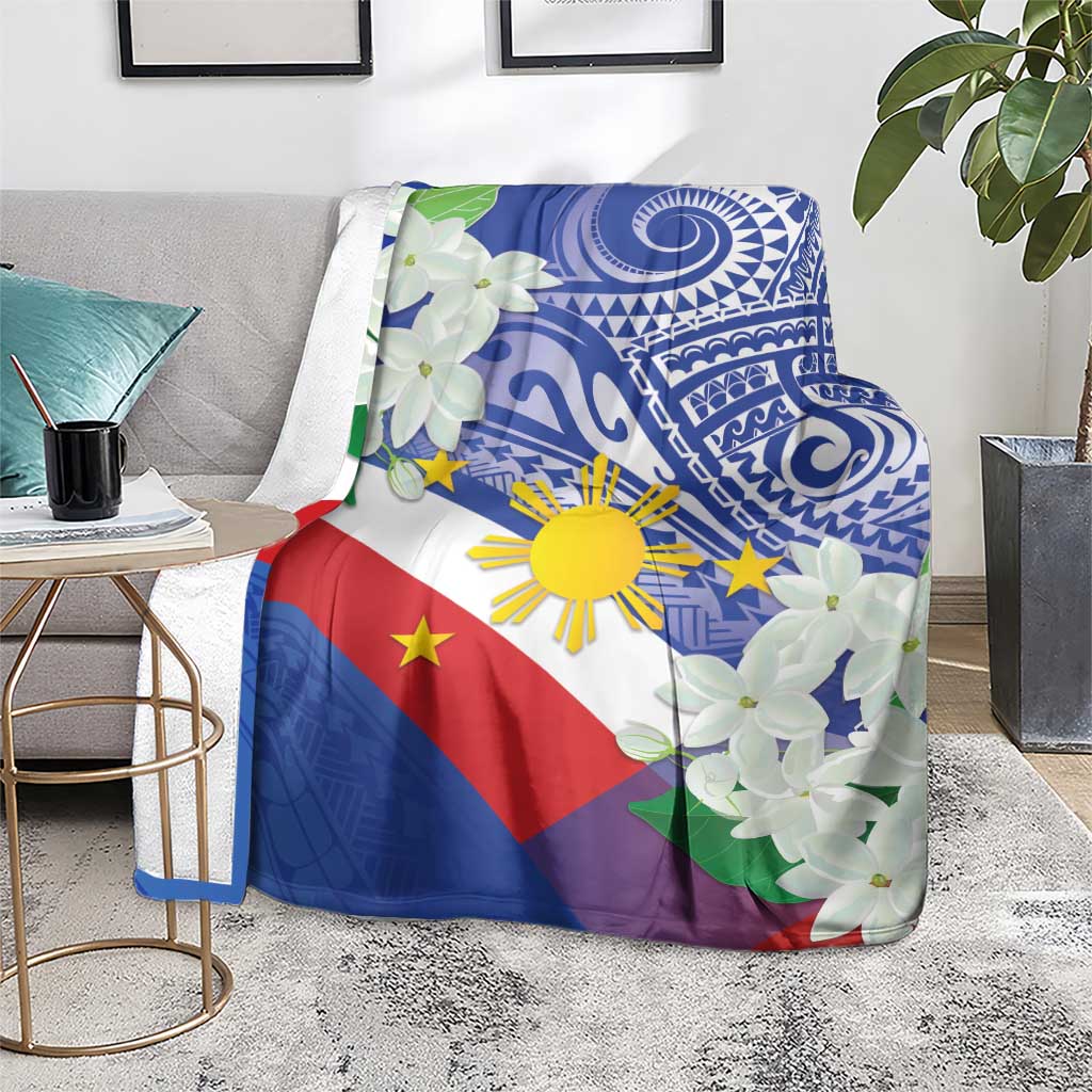 Philippines flag blanket with blue tribal design, white jasmine flowers, spread on chair