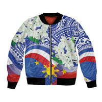 Blue bomber jacket with Philippines flag panel, tribal patterns, white blossoms, front zipper
