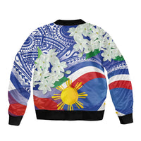 Blue bomber jacket with Philippines flag print, white flowers, black ribbed cuffs