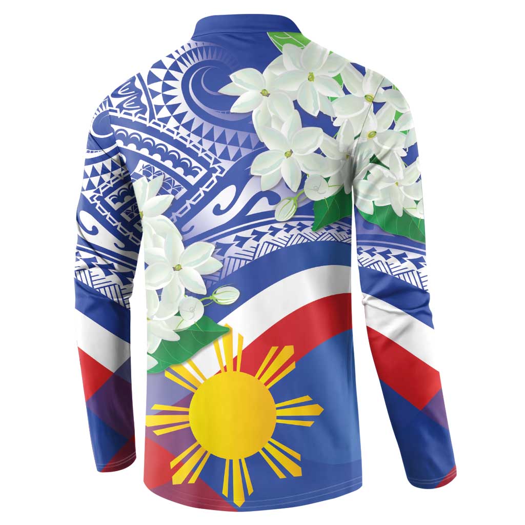 Blue long-sleeve button polo sweatshirt, angled view with white flowers and sun-star graphic