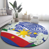 Round Philippines flag area rug, blue swirls and sun center with green floral border