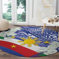 Round Philippines flag area rug with blue tribal swirls, yellow sun, red stripe, flowers