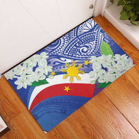 Rubber doormat with Philippines flag colors, jasmine flowers, and Polynesian tribal motifs