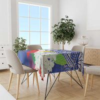 Philippines flag tablecloth draped over dining table, blue tribal design with jasmine flowers.