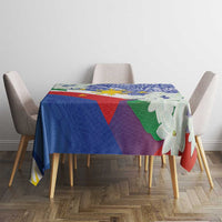 Philippines flag tablecloth on table with purple, green, blue graphics and jasmine blossoms.