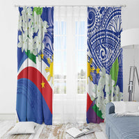 Flag-themed curtain panels with white jasmine blossoms and blue tribal pattern in living space