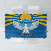 Personalized blue tablecloth with falcon, wings, mountains, rising sun, and “YOUR TEXT”.