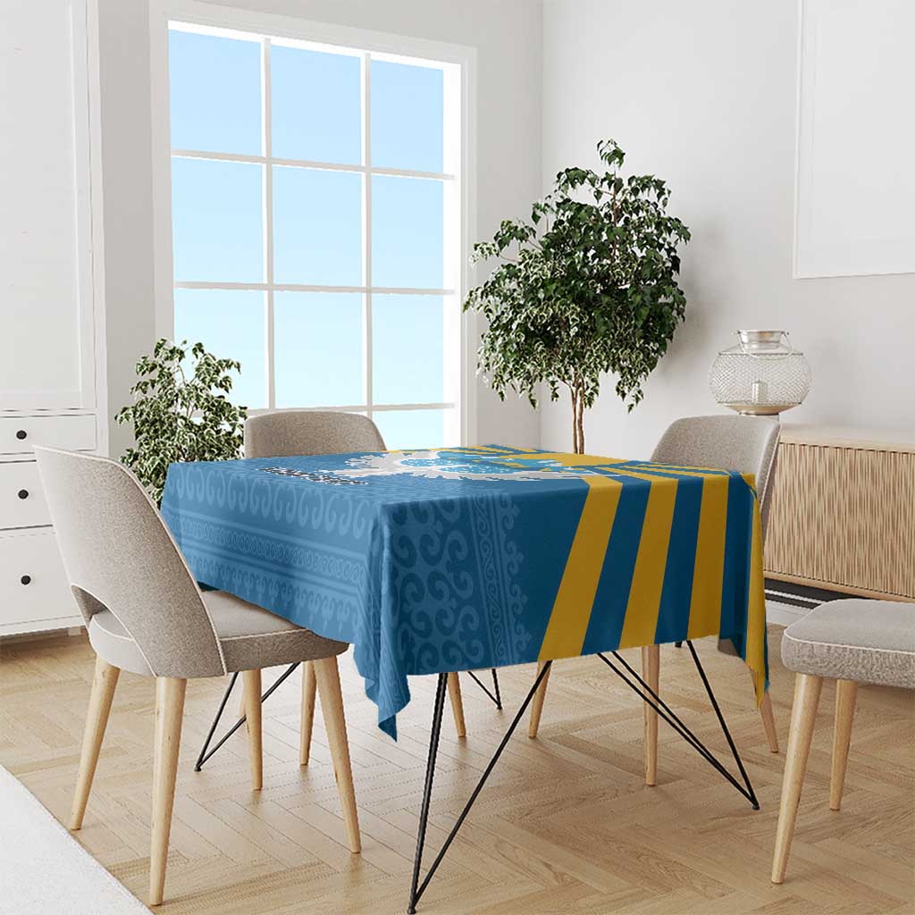 Blue personalized tablecloth with falcon-and-mountains print and yellow stripe accents.