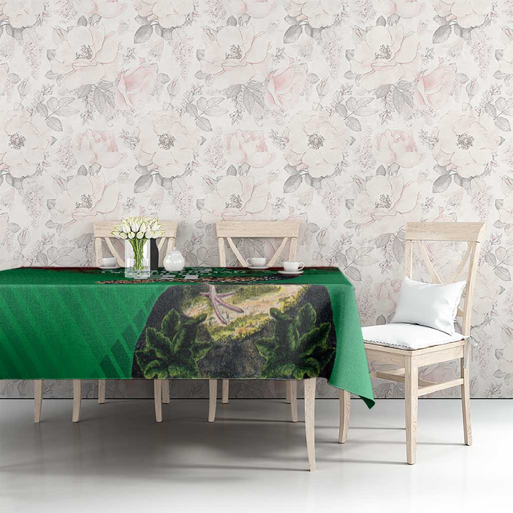 Green printed tablecloth with forest path scene on dining table