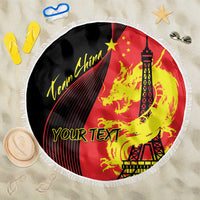 Round fringed beach blanket with red, black, and yellow dragon plus Eiffel Tower graphic