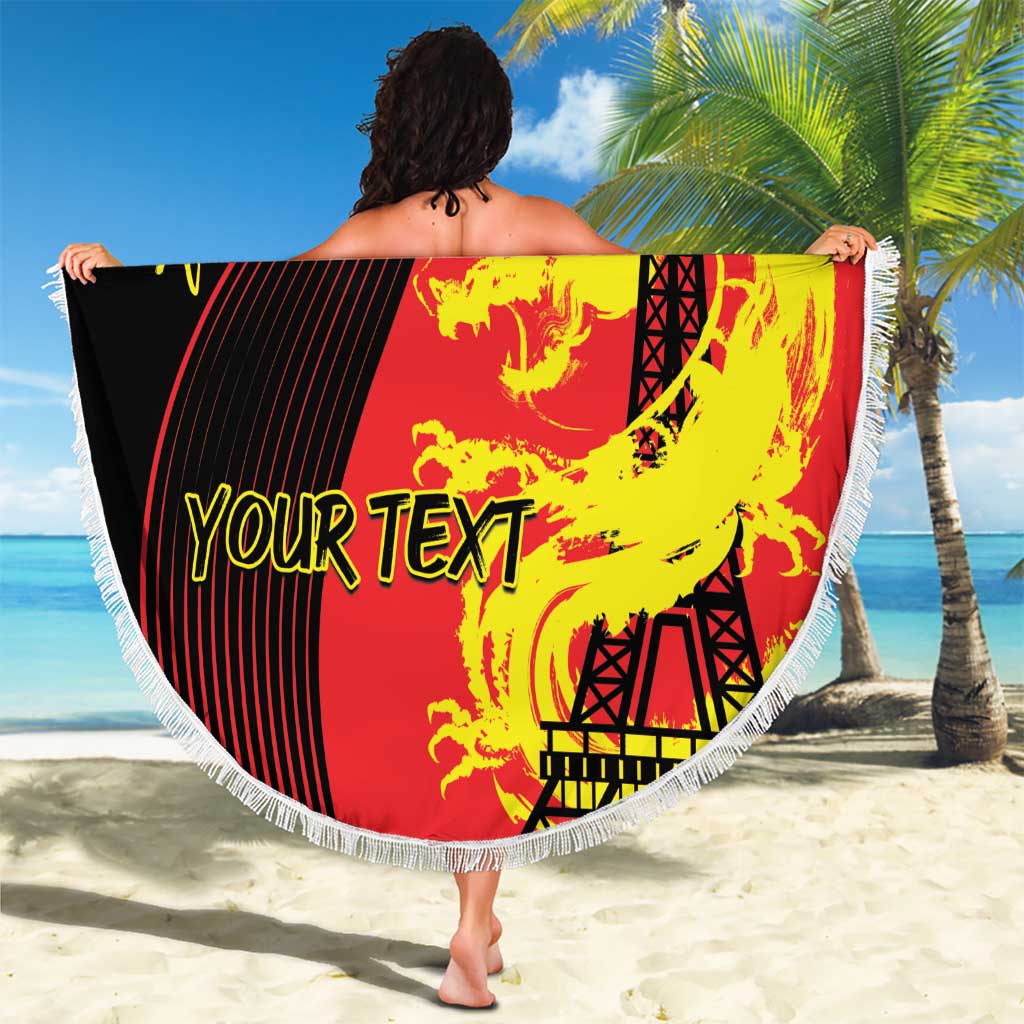 Round fringed beach blanket stretched outdoors, featuring dragon and Eiffel Tower graphic