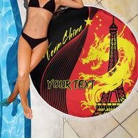 Round fringed beach blanket with dragon and Eiffel Tower graphic, red and black with yellow