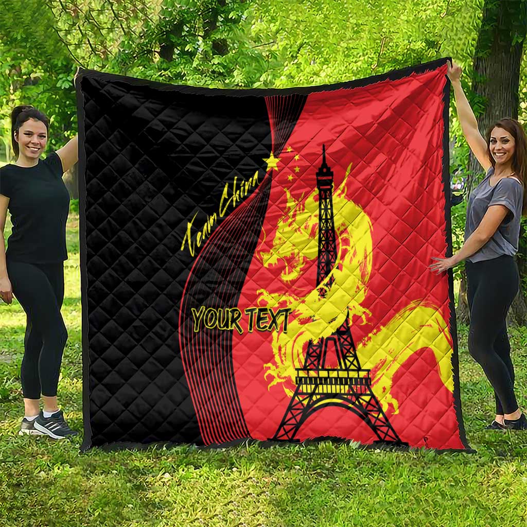 Red and black quilt with Eiffel Tower and dragon artwork, diamond-quilted fabric