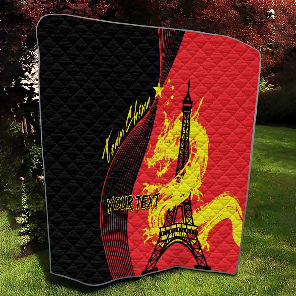 Red and black quilted sport blanket with Eiffel Tower, dragon and flag graphics